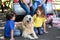 Children ruffling the dogs fur