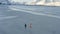 Children running walking and having fun  on a winter polar beach Ramberg