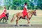 Children in Russian national attire and ponies at the equestrian sports festival