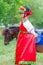Children in Russian national attire and ponies at the equestrian sports festival