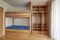 Children`s bunk bed with large build-in wardrobe with open doors