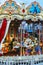 Children`s carousel in Moscow. Two-storey carousel with horses. Merry go round horses