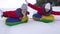 Children`s Christmas holidays outdoors. Happy children have fun riding snow saucer and laugh on snowy winter road on