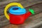 Children\'s colorful watering can for watering plants in the garden