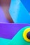 Children`s Coloured Windmill Toy in the Wind Abstract Close Up