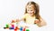 children\\\'s creativity. Cute caucasian preschool little girl painting picture draws with fingers on white background