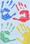 Children`s drawing: multi colored prints of children hands. Friendship concept