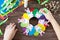 Children`s Easter gift wreath with colorful eggs and Easter bunnies. Paper, scissors, glue