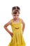 Children`s emotions: angry little girl in a yellow dress