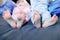 Children\'s feet on the bed.Two pairs of children`s feet on the bed.