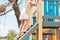 Children& x27;s games. The little girl climbing the stairs to the wooden tower game. Side view