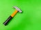 Children`s hammer, on a green background. The tool for the child, etsky repairman, development for children, preparing the child