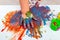 Children`s hand in paints. Finger paints. baby Artwork . Flat lay