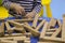 Children`s hands collect a wooden constructor. children`s puzzle puzzle of wooden parts. child plays and develops with wooden el