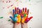 children\\\'s hands covered with paint vibrant colors