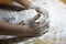 Children`s hands and dough. Little boy kneading a dough. Healthy handmade food concept. bakery products, pizza, flour. cooking