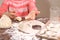 Children\'s hands holding a dough for molding dumplings