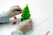Children`s hands mould a New Year tree