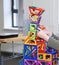Children`s hands play with designer for the development of fine motor skills and creative thinking. Bright and colorful, allows