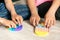 Children& x27;s hands play fashionable sensory bright toy anti-stress pop it. Silicone toy with soft bubbles relieve stress