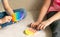 Children& x27;s hands play fashionable sensory bright toy anti-stress pop it. Silicone toy with soft bubbles relieve stress