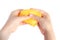 Children`s hands press homemade goo and yellow slime. White background