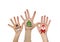 Children\'s hands raising up with painted Christmas symbols: Santa Claus, Christmas tree, Snow man