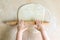 Children`s hands rolled dough