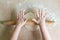 Children`s hands rolled dough