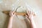 Children`s hands rolled dough