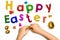 children\'s hands and words fashioned from clay Happy Easter on a white background