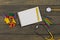 Children's healthy development concept - blank notepad, yellow stethoscope, colorful wooden jigsaw puzzles, crayons