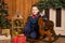 Children`s joyful memories of Christmas holidays. Santa gave a little boy a swing horse