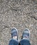 Children`s legs on a gravel background