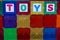 Children`s magnetic building tiles with the word TOYS