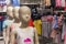 Children`s mannequins with summer clothes in the store