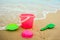 Children`s pail and colored molds on the beach in the sand