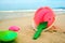 Children`s pail and colored molds on the beach in the sand