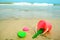 Children`s pail and colored molds on the beach in the sand