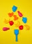 children\\\'s plastic multi-colored toys laid out in the form of a Christmas tree