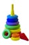 Children`s plastic toy pyramid in a packing grid on a white background. Children`s activity game for learning colors and shapes