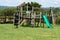 A children`s play area with swings and slide.