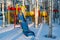 Children`s playground in the birch park in winter, i