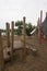 Children`s playground made of environment, eco-friendly materials. Wooden tree trunk sides, swings, net bridges, climbers.