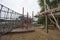 Children`s playground made of environment, eco-friendly materials. Wooden tree trunk sides, swings, net bridges, climbers.