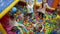 Children`s playroom. Children play in a dry basin filled with plastic colored balls.