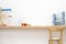 Children's Playroom with wooden table and child chair and some toys, modern scandinavian style