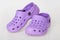 Children`s purple rubber sandals flip-flops,  slippers isolated on the white background.