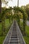 Children`s railway in a summer park in perspective with an arch made of weaving plants