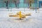 Children`s revolving carousels in the ordinary courtyard of an apartment building. Russia. Winter